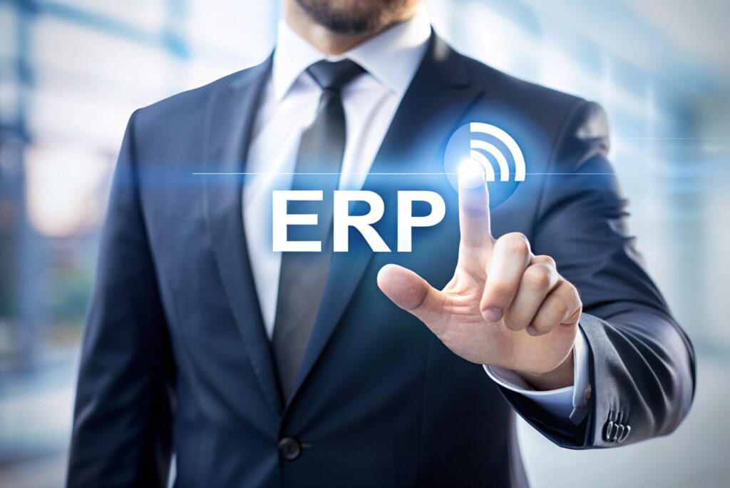 a person in a suit pointing to the word erp